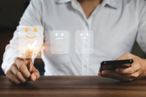 Businessman Are Choosing Screen On The Happy Smiley Face Icon To